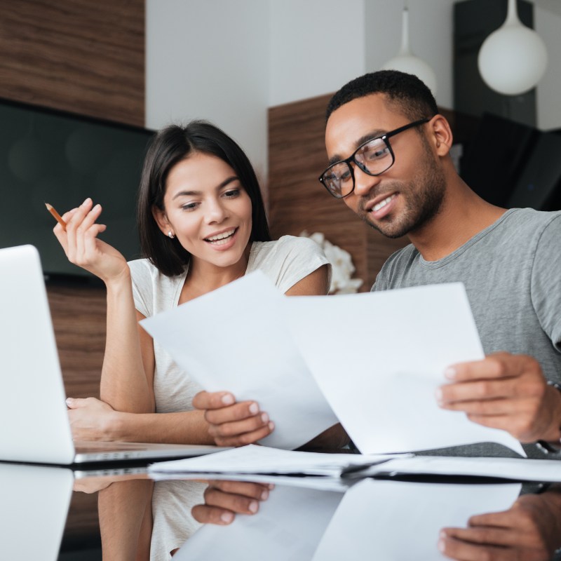 Couple looking at white papers